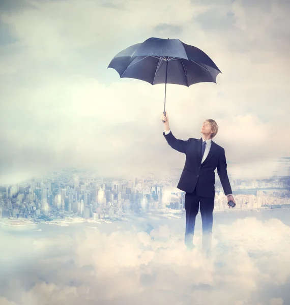 Geschäftsmann mit Regenschirm — Stockfoto