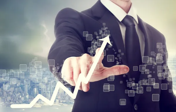 Businessman Touching a Chart Indicating Growth — Stock Photo, Image