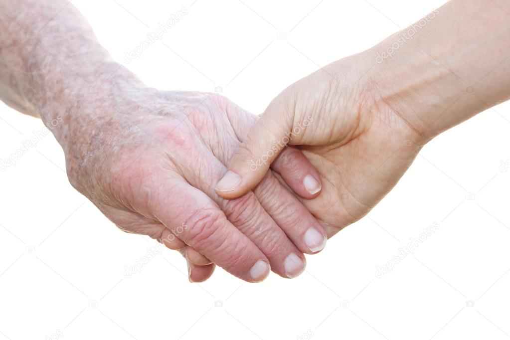Senior and young holding hands