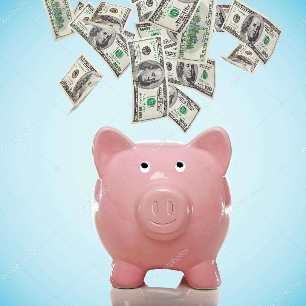 Piggy bank with hundred dollar bills — Stock Photo © Melpomene 23097594