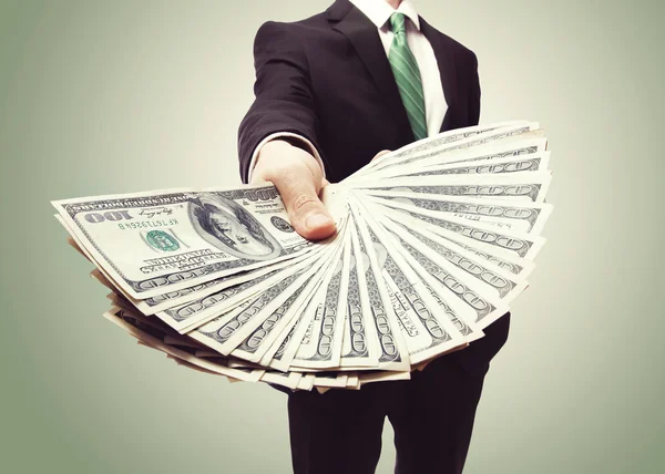 Business Man Displaying a Spread of Cash — Stock Photo, Image