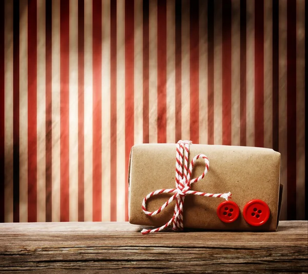 Handmade gift box over striped background — Stock Photo, Image