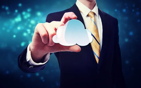 Businessman holding a cloud icon — Stock Photo, Image