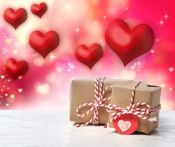 Handmade gift boxes with red hearts — Stock Photo, Image