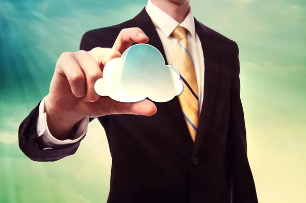 Imprenditore che tiene l'icona del cloud computing — Foto Stock