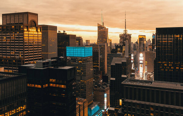 NEW YOKK, NY - JAN, 04, 2016: Times Square, Midtown Manhattan, New York skyline at sunset