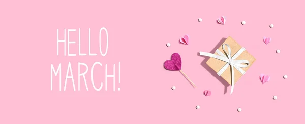 Hello March message with a small gift box and hearts — Stock Photo, Image