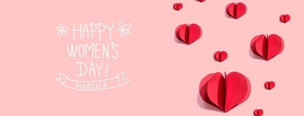 Happy womens day message with red paper hearts — Stock Photo, Image