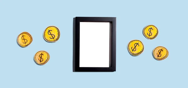 Blank photo frame with coins - earn online theme — Stock Photo, Image