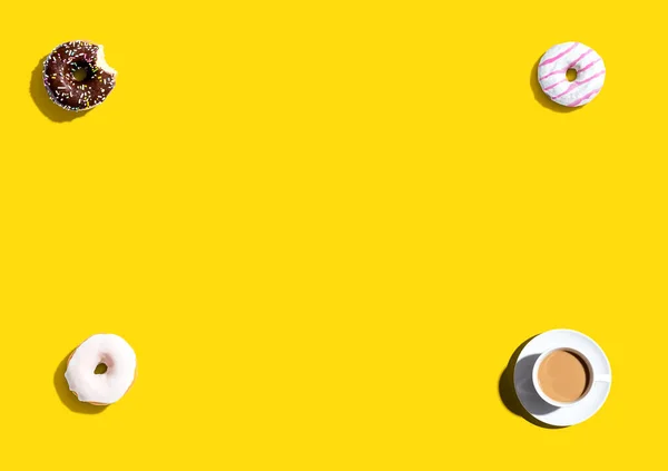 Donuts and a cup of coffee — Stock Photo, Image