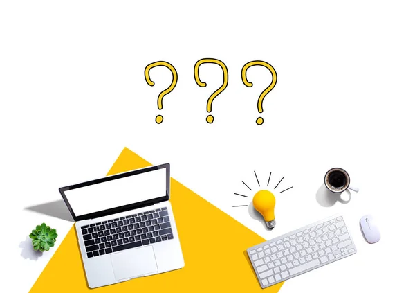 Question marks with computers and a lightbulb — Stock Photo, Image