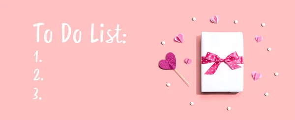 To Do List theme with a gift box and hearts — ストック写真