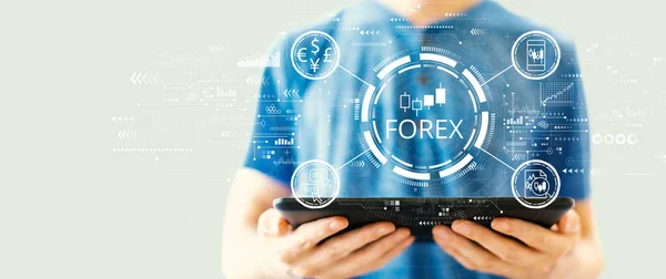 Forex trading concept with man using a tablet — стоковое фото