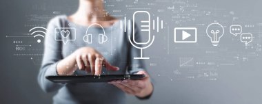 Podcast theme with woman using a tablet
