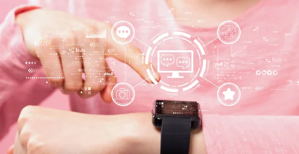 Social media theme with woman pressing smart watch — Stok fotoğraf