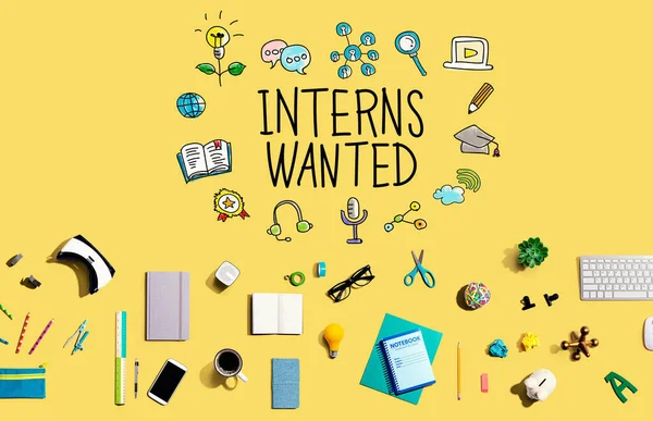 Interns Wanted with collection of electronic gadgets and office supplies