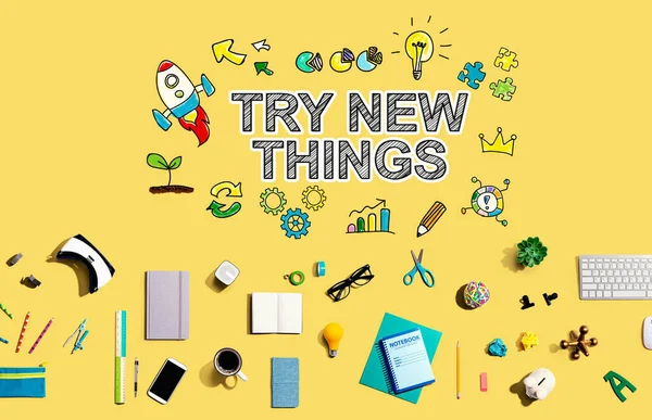 Try New Things with collection of electronic gadgets and office supplies