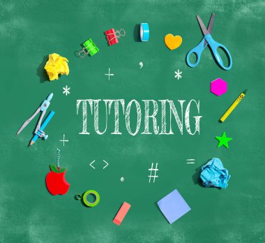 Tutoring theme with school supplies on a chalkboard - flat lay