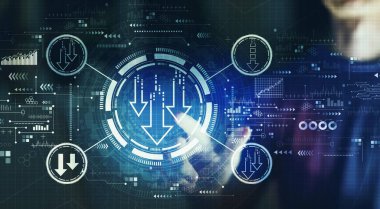 Descending arrows with young man touching a digital screen at night