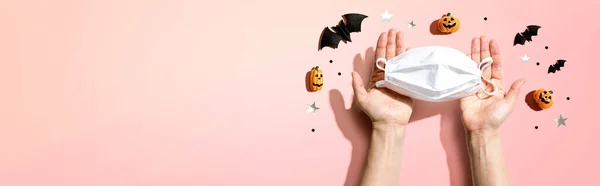 Facial masks with Halloween objects - flat lay