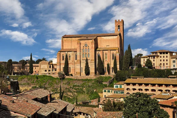 Siena, Tuscany, Italy: cityscape with the medieval church Basilica of San Domenico on the hill in the old town of the city