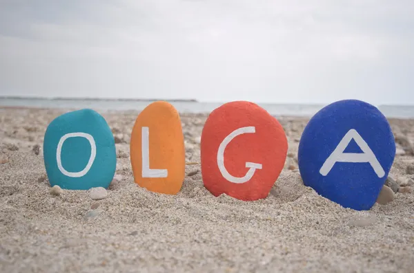 Olga, female name on colourful stones — Stock Photo, Image