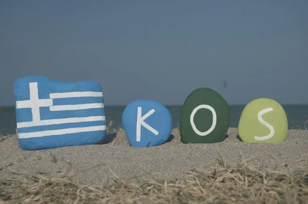 Souvenir of the greek isle Kos on colourful stones — Stock Photo, Image