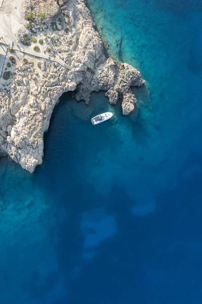 Drone aerial photograph of Cape Greko peninsula with Agioi Anargyroi church on the rocks. Cruise touristic boats sailing. — Stock Photo, Image