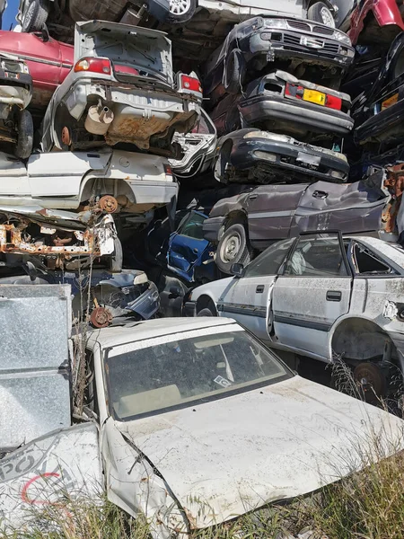 Pile of various scrap cars and other metals on a junk yard ready recycling industry. — Stock Photo, Image