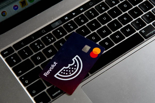 Revolut Credit visa card on computer Keyboard. Digital money, internet banking — стокове фото