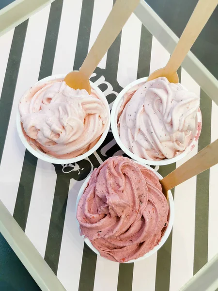 Scoops of frozen yogurt strawberry ice cream on table. Sweet sugary dessert. — Stock Photo, Image