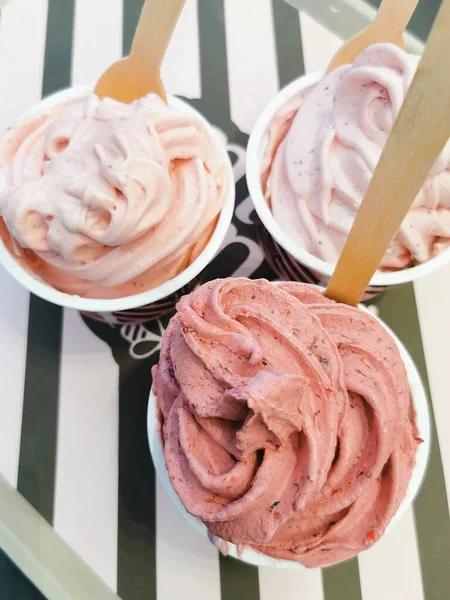 Scoops of frozen yogurt strawberry ice cream on table. Sweet sugary dessert. — Stock Photo, Image