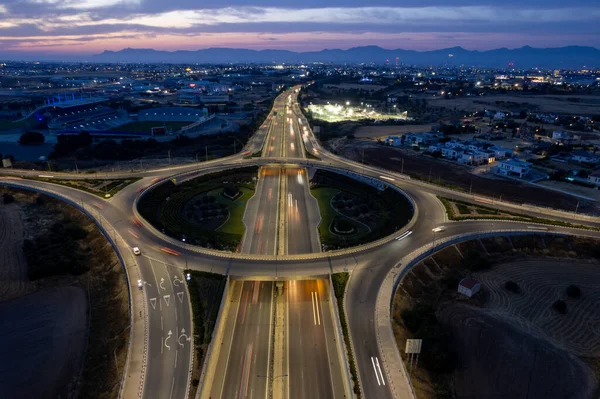 Aerial drone view of highway junction. Roundabout cars moving fast. Transportation infrastructure — 스톡 사진