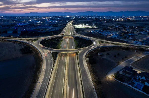 Aerial drone view of highway junction. Roundabout cars moving fast. Transportation infrastructure — 스톡 사진