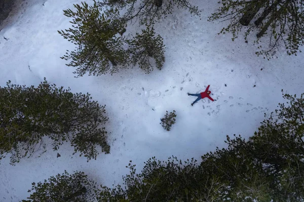 Drone Aerial Woman Wearing Warm Clothing Lie Fresh Snow Winter — 스톡 사진