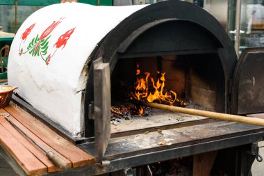burning coals in the oven before baking pizza
