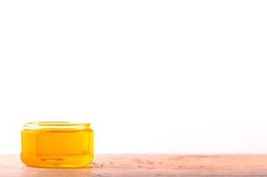 Olive oil. Spanish olive oil in glass transparent bowl with copy space. Close-up, Isolated on white background.