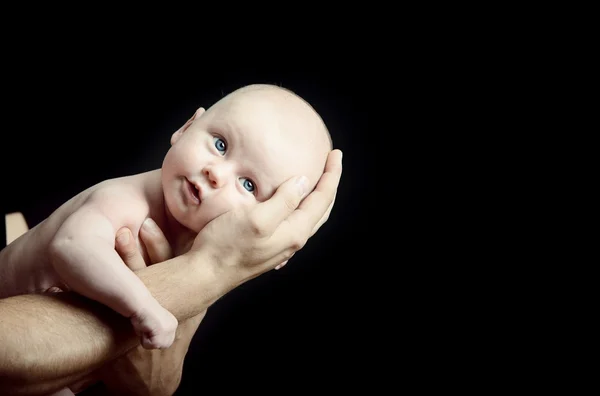 Infant held in the hands of the parent — Stock Photo, Image