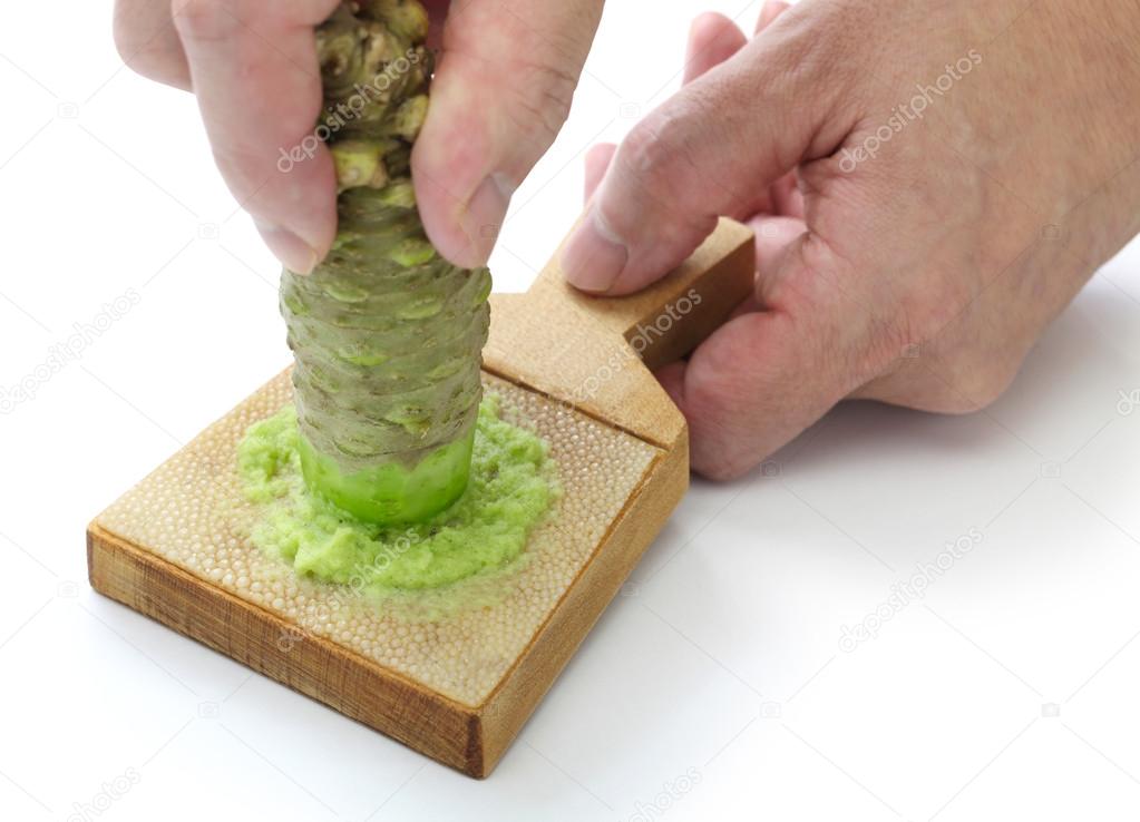 Wasabi grater picture Grating fresh wasabi by shark skin grater