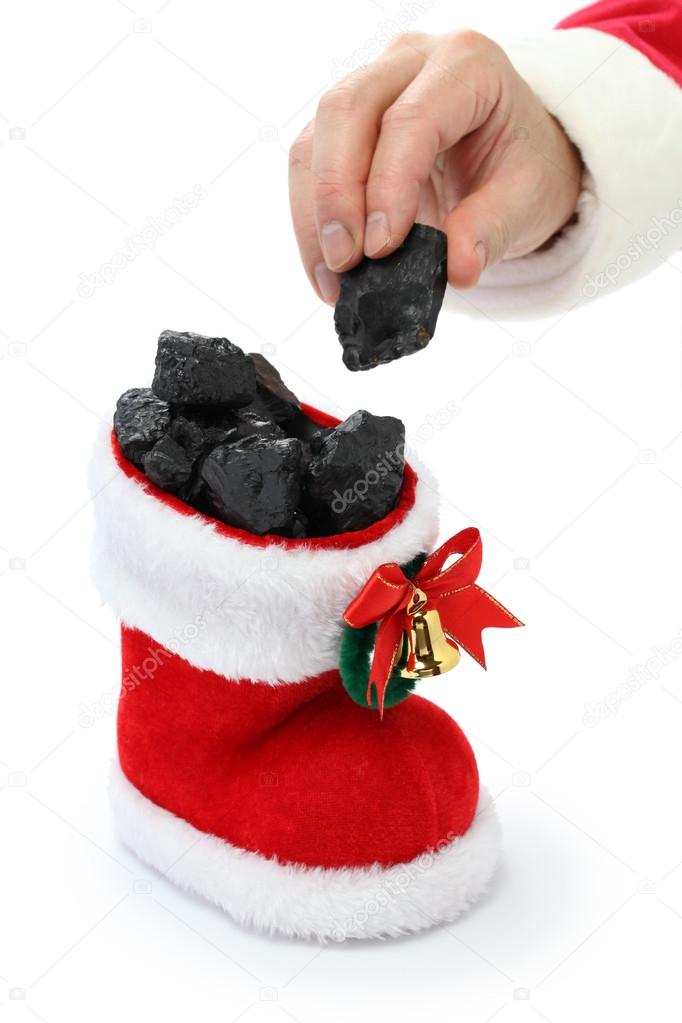 The hand of Santa Claus has put coal in the stocking