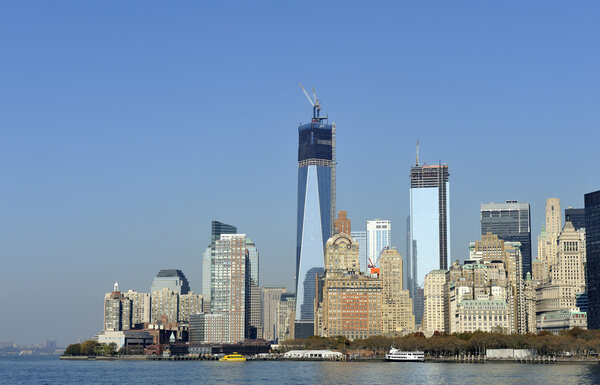 Downtown Manhattan skyline with World Trade Center Building construction peaking above the city