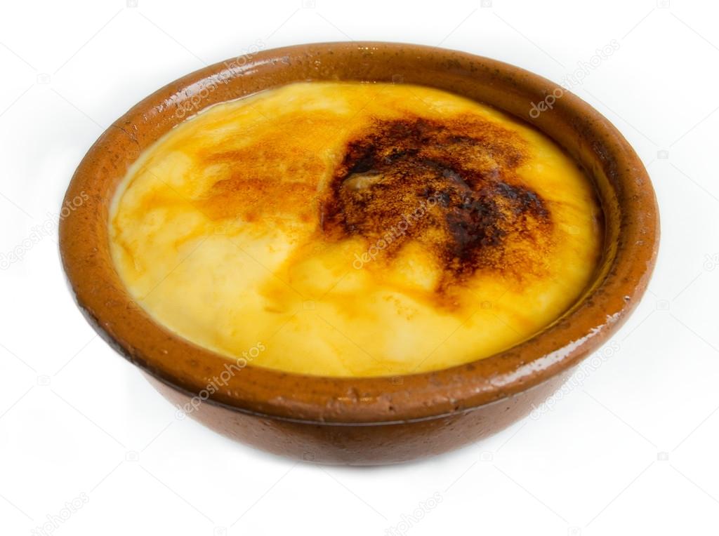 Crema Catalana or Creme Brulee in rustic bowl. Traditional dessert in France and Catalonia.