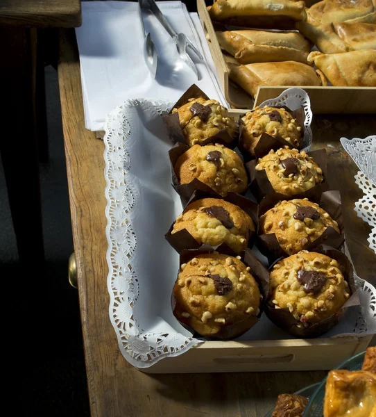 Muffins in a wooden tray. — Stock Photo, Image