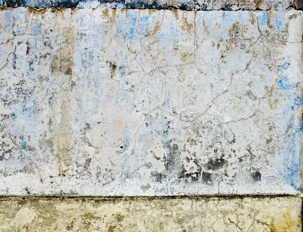 Abgenutzte blaue Farbe Textur in alten Steinmauern. — Stockfoto