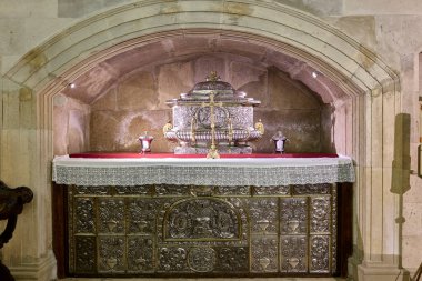 Alcala de Henares, Spain - May 13, 2022. Silver urn with the relics of the Holy Children in the crypt of Magistral Cathedral of Saints Justo and Pastor, Alcala de Henares. Region of Madrid, Spain.