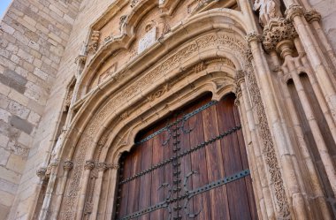 Portal detail on the western facade of the Magistral Cathedral of Saints Justo and Pastor. Alcala de Henares, Region of Madrid, Spain. 