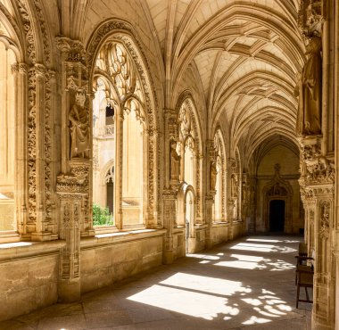 Toledo, Spain - June 30, 2022. The lower floor of the cloister of the San Juan de los Reyes monastery, by Enrique Egas. Toledo, Castilla La Mancha, Spain. clipart