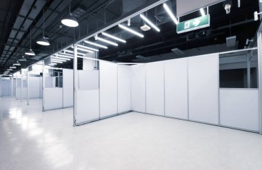 Trade show interior with empty booth inside the business trade show pavilion.