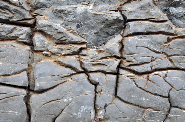 Oberflächenstruktur aus Kalkstein mit Rissen — Stockfoto