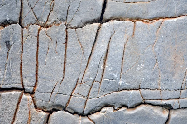 Limestone surface texture with cracks — Stock Photo, Image